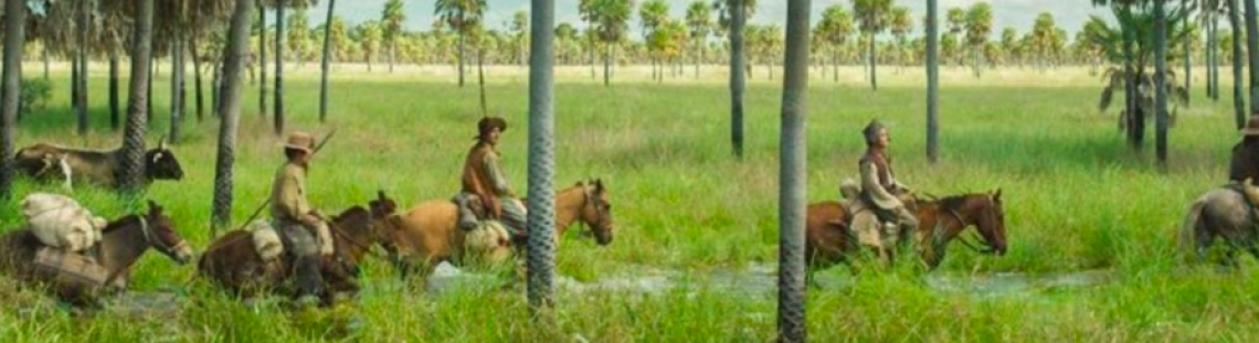 hombres a caballo