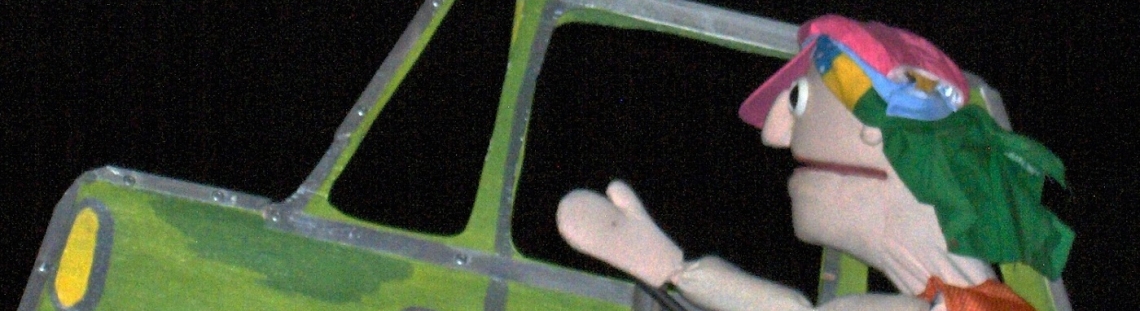 Títere tomando un carro